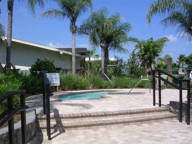 view of pool featuring a hot tub