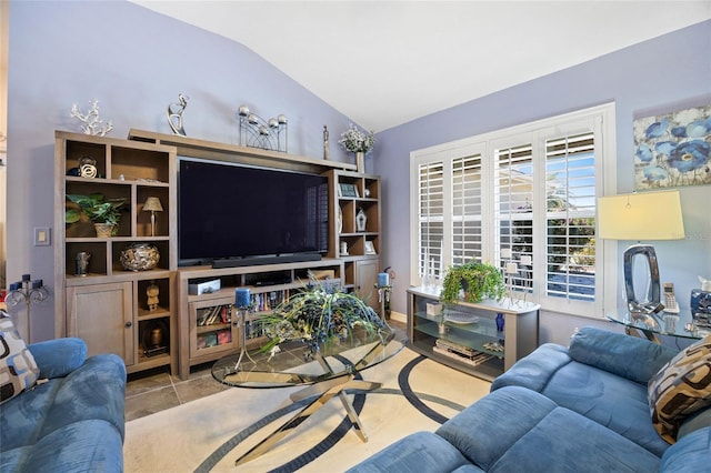 living room featuring lofted ceiling and tile patterned flooring