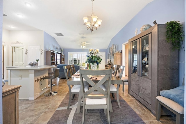 dining area with visible vents, ceiling fan with notable chandelier, and lofted ceiling