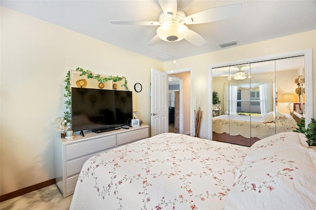 bedroom with a closet, visible vents, ceiling fan, and baseboards