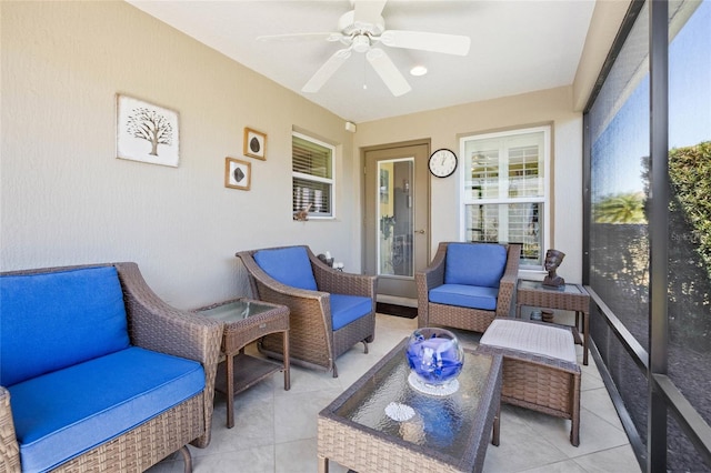 sunroom / solarium featuring ceiling fan