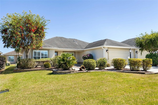 ranch-style home featuring stucco siding, an attached garage, and a front yard