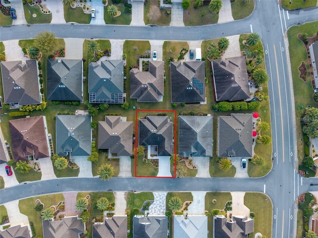 birds eye view of property with a residential view