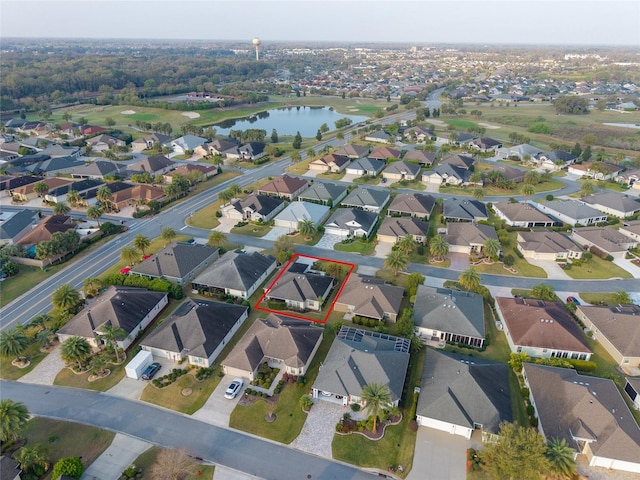 drone / aerial view featuring a water view and a residential view