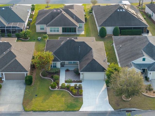 birds eye view of property with a residential view