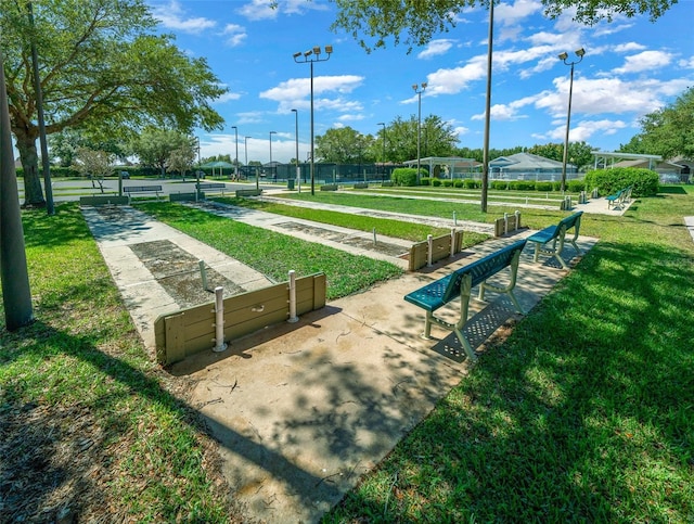 surrounding community featuring a lawn