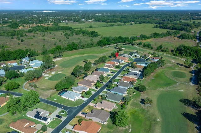 aerial view with golf course view and a residential view