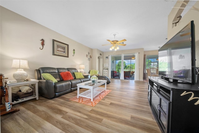 living area featuring ceiling fan and light wood-style floors