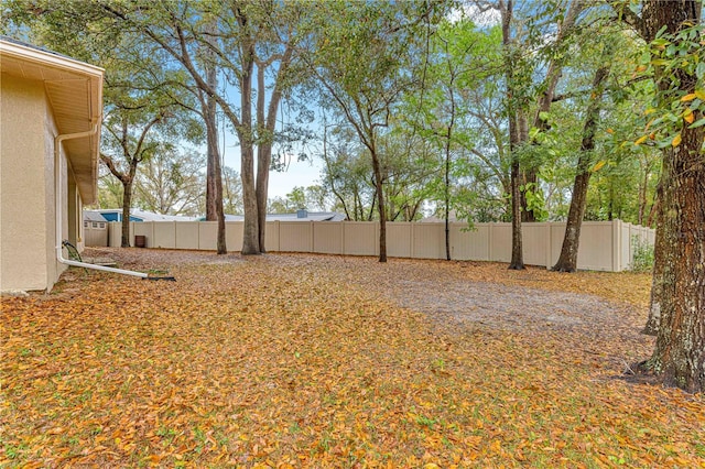 view of yard with a fenced backyard