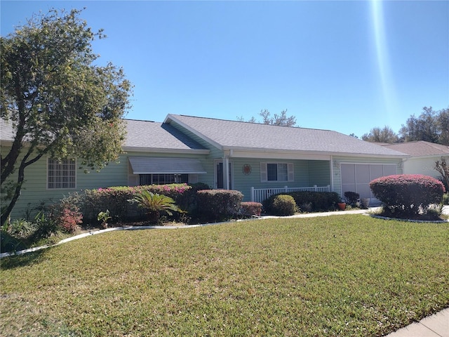 ranch-style home with a front lawn and an attached garage