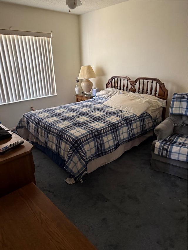 carpeted bedroom featuring a textured ceiling