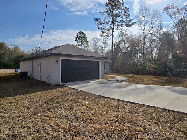 garage with central AC and driveway