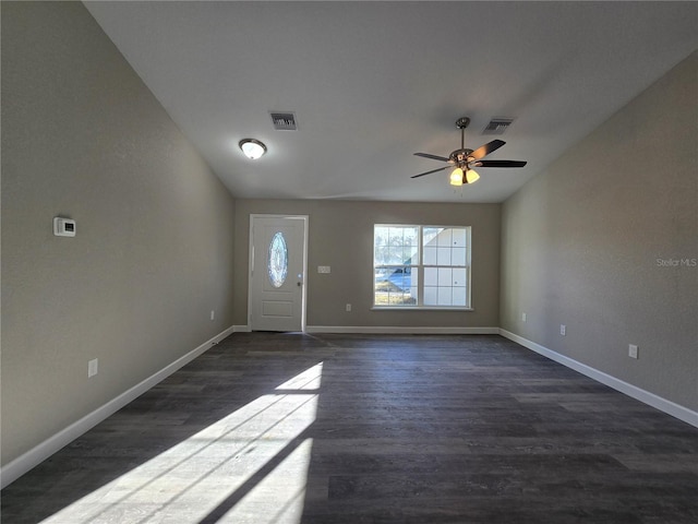 entrance foyer with dark wood finished floors, visible vents, and baseboards