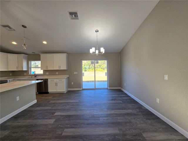 kitchen with visible vents, stainless steel dishwasher, an inviting chandelier, and light countertops