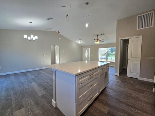 kitchen featuring visible vents, dark wood finished floors, open floor plan, and a center island