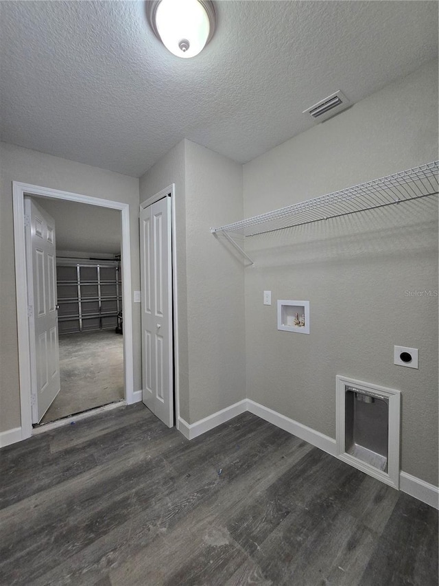 washroom with baseboards, visible vents, hookup for an electric dryer, dark wood-style flooring, and washer hookup