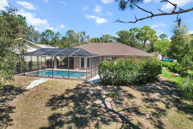 outdoor pool featuring a lanai