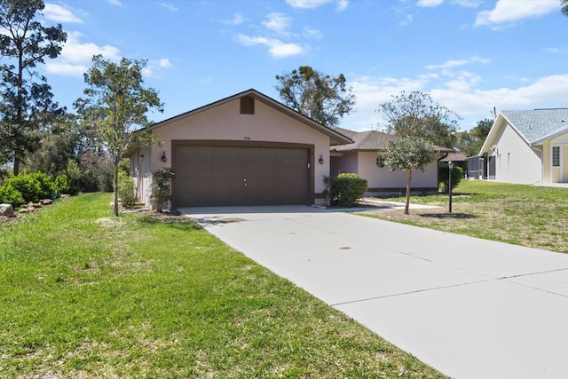 ranch-style home featuring stucco siding, concrete driveway, a front yard, and a garage