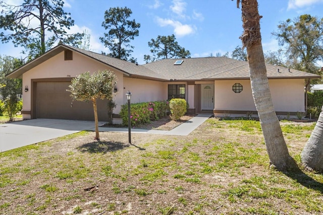 ranch-style home featuring stucco siding, driveway, an attached garage, and a shingled roof