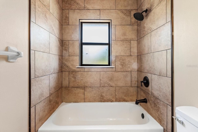 bathroom featuring toilet and bathtub / shower combination