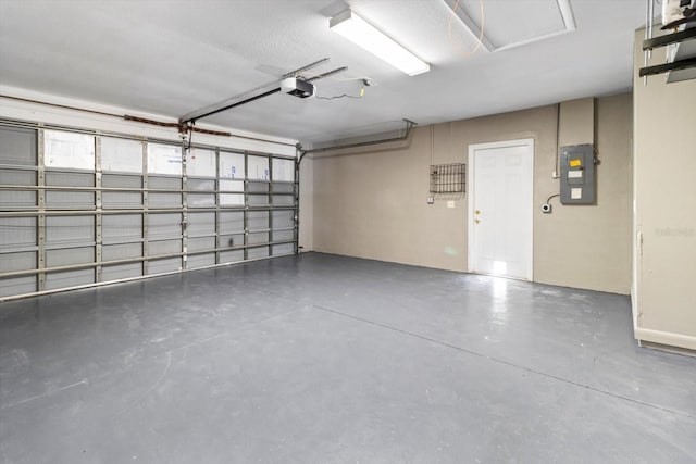 garage with electric panel and a garage door opener