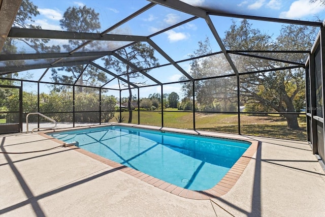 pool featuring glass enclosure and a patio