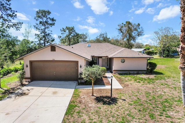 ranch-style house featuring stucco siding, driveway, a front yard, and an attached garage