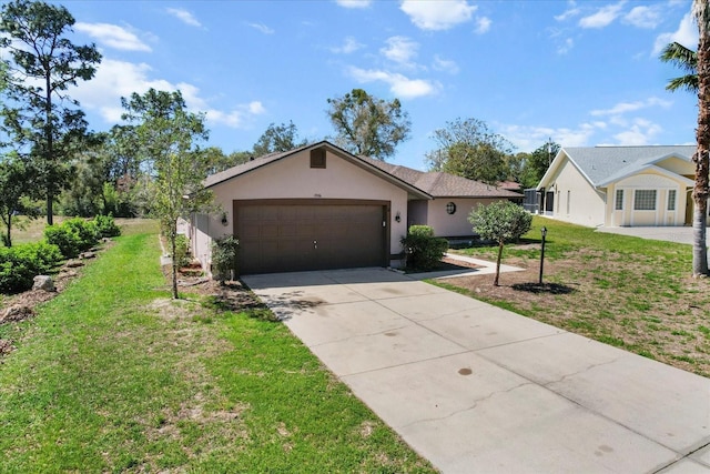 single story home featuring stucco siding, an attached garage, concrete driveway, and a front lawn