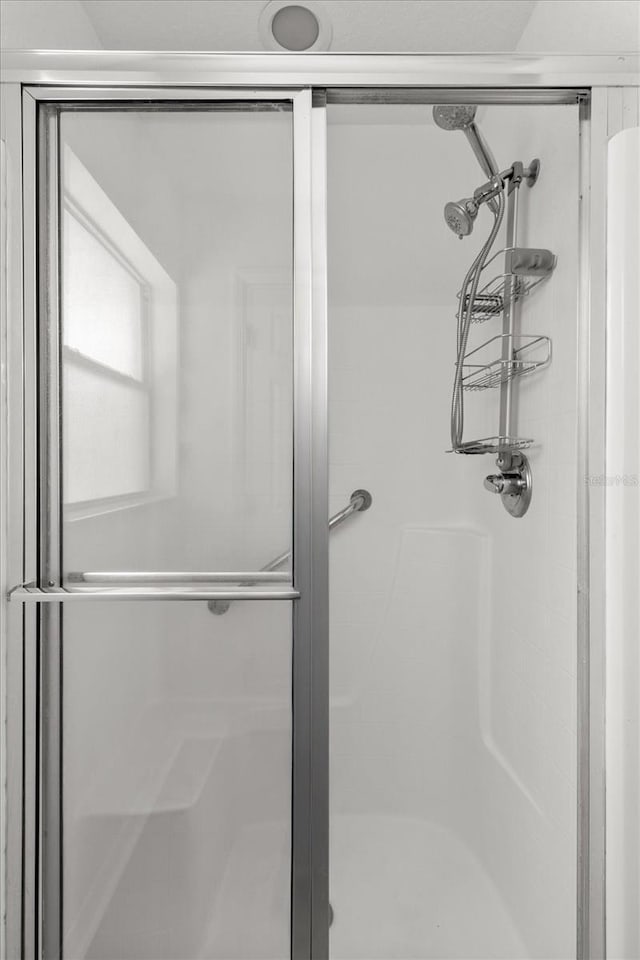 bathroom featuring a shower stall