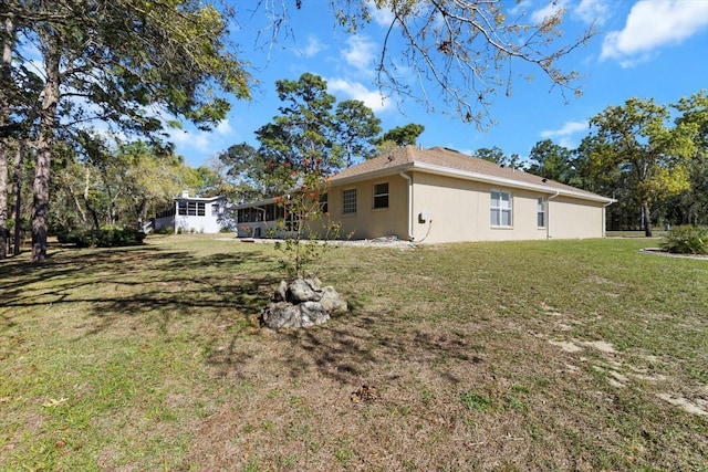 view of yard featuring a sunroom