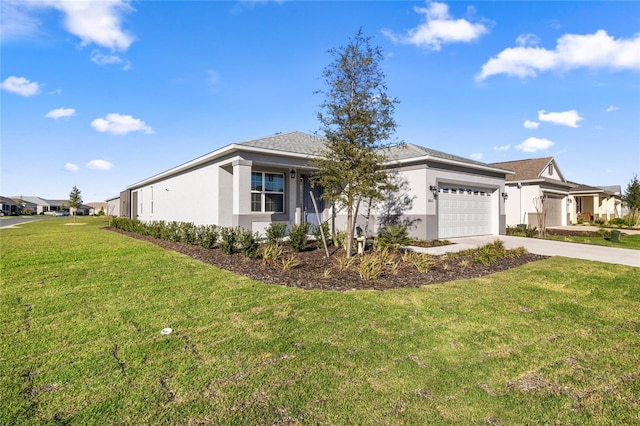 view of front of home featuring stucco siding, a front yard, a garage, and driveway