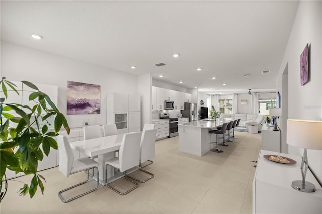 dining room with recessed lighting, visible vents, and a ceiling fan