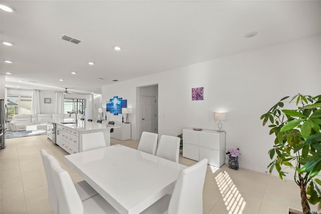 dining space with light tile patterned floors, visible vents, and recessed lighting