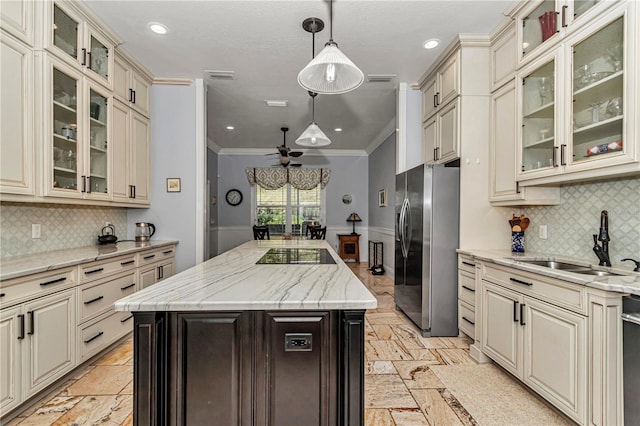 kitchen featuring cream cabinets and stainless steel appliances