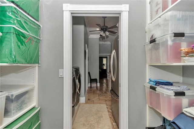 laundry room featuring laundry area, washer and dryer, and a ceiling fan