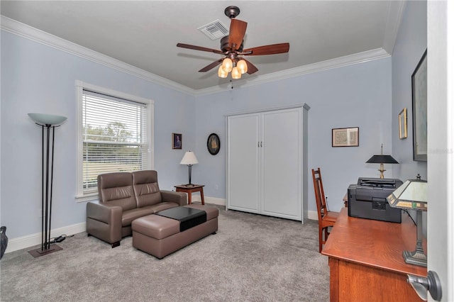 carpeted office space featuring visible vents, a ceiling fan, baseboards, and ornamental molding