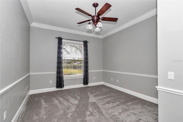 carpeted empty room featuring ceiling fan, baseboards, and ornamental molding