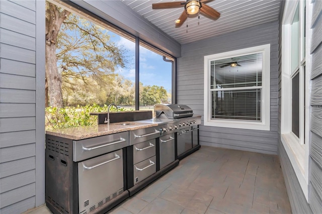 exterior space featuring a sink and a ceiling fan