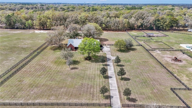 birds eye view of property with a rural view and a view of trees