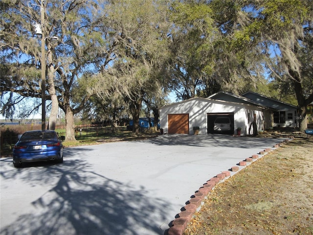 view of side of property with a detached garage