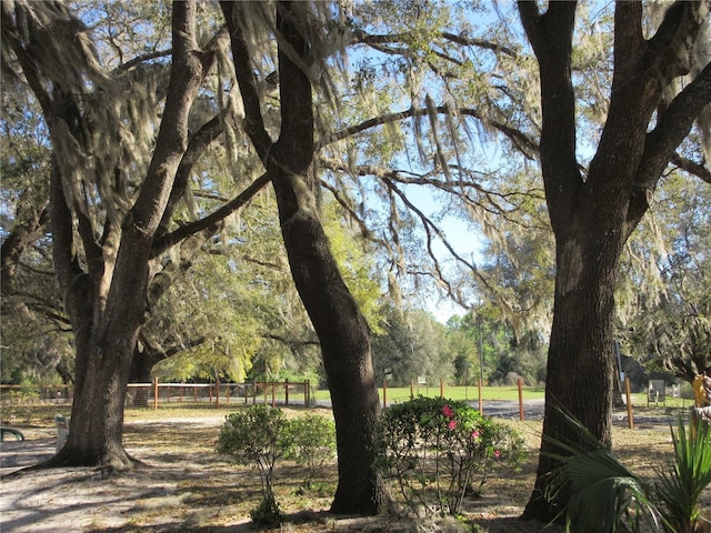 view of community featuring fence