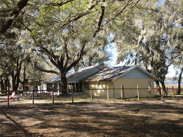 view of side of property with fence