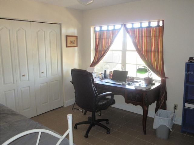 office featuring tile patterned flooring and baseboards