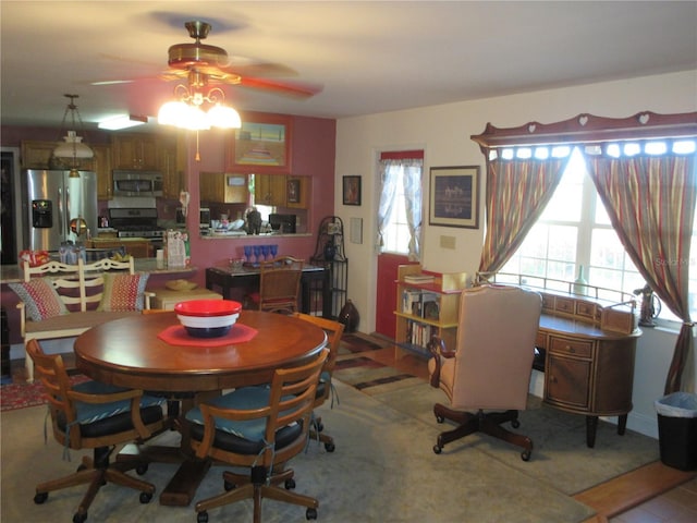 dining area featuring a ceiling fan