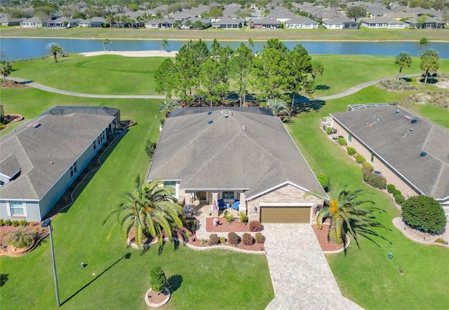 drone / aerial view featuring a residential view and a water view