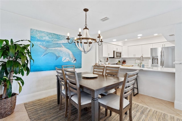 dining space featuring visible vents, a notable chandelier, recessed lighting, light tile patterned floors, and baseboards