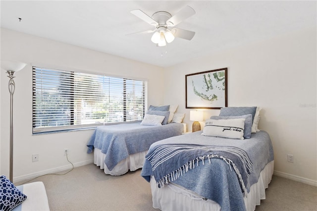 bedroom with baseboards, carpet, and ceiling fan