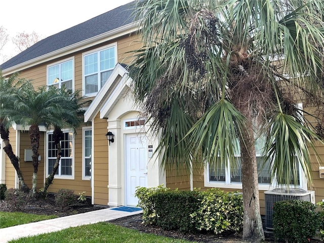 doorway to property with central AC