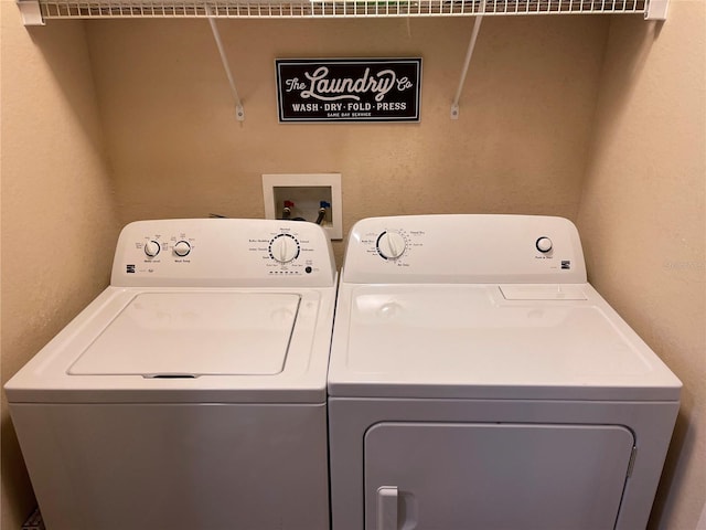 washroom featuring laundry area and independent washer and dryer