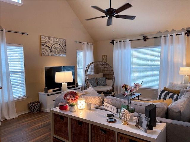 living room with dark wood finished floors, a healthy amount of sunlight, high vaulted ceiling, and ceiling fan